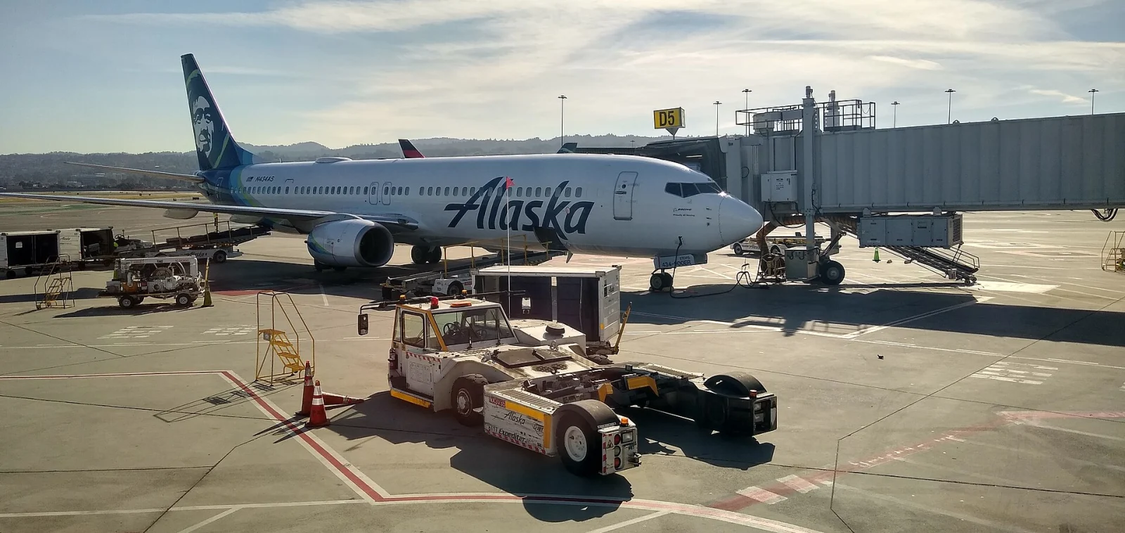 Alaska Airlines aircraft parked at a gate at San Francisco International Airport.
