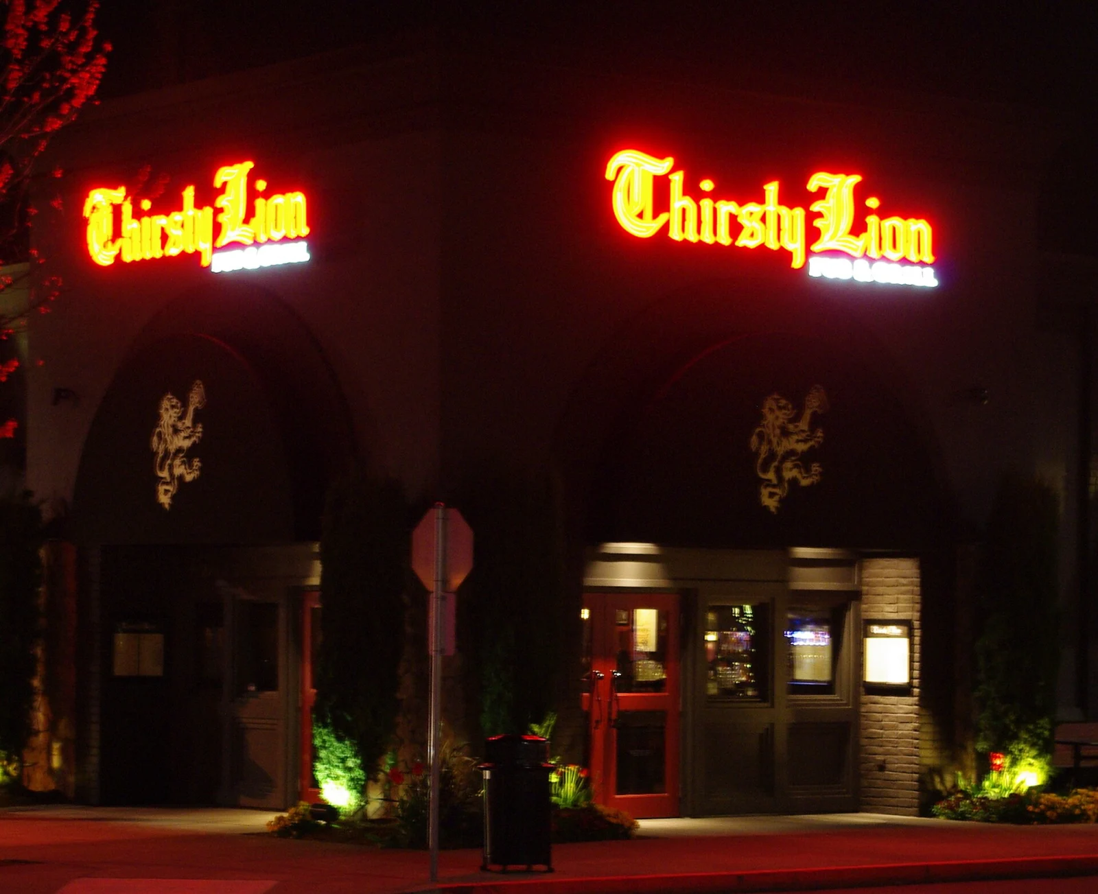 Thirsty Lion restaurant exterior illuminated at night in Hillsboro, Oregon.